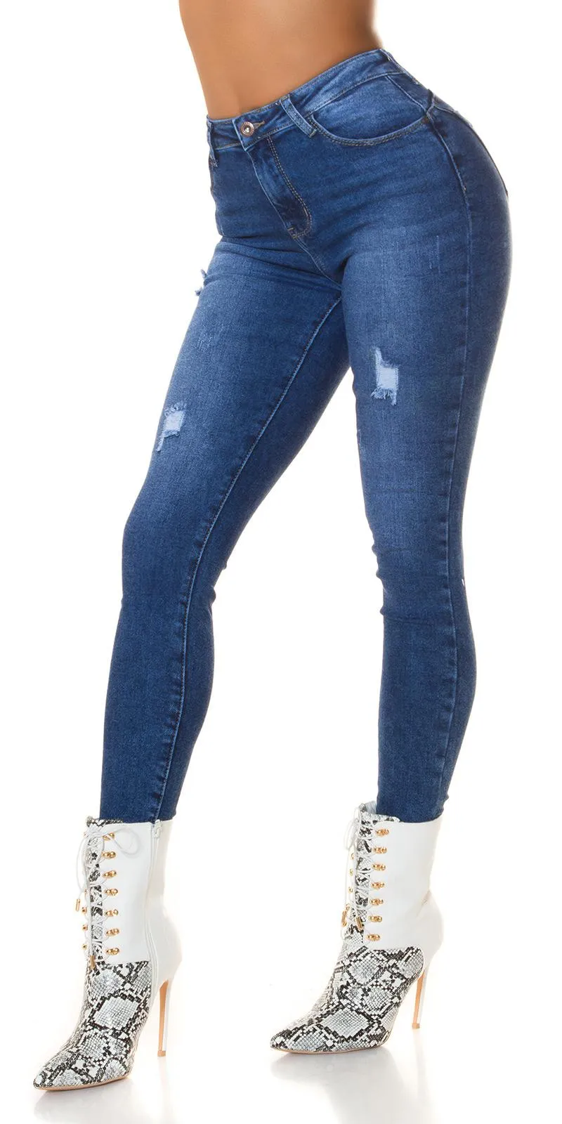 Jeans ajustados gastados de moda 